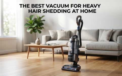 Modern upright vacuum in a living room with bold title text about heavy hair shedding solutions.