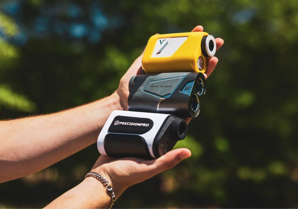 Close-up of affordable golf rangefinder measuring distance on fairway