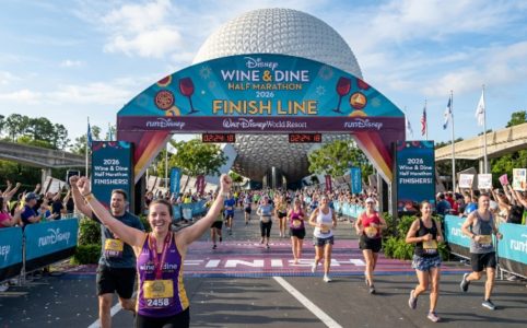 Runners crossing the finish line at the Disney Wine and Dine Half Marathon 2026 in front of EPCOT at Walt Disney World Resort in Orlando, Florida
